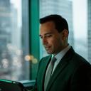 Bank compliance leader reading a digital briefing beside a high-rise window